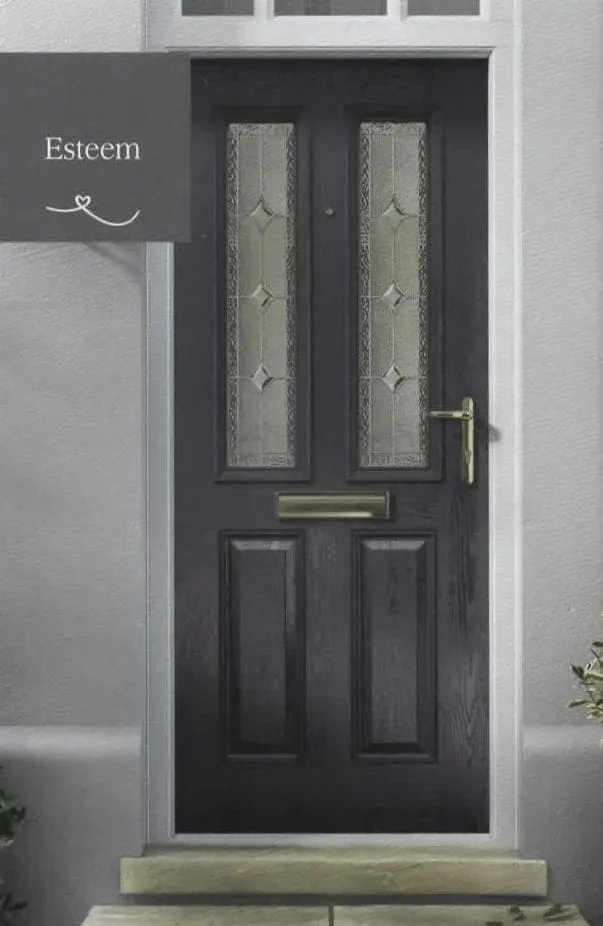 Anthracite grey composite front door with two decorative glazed panels and gold handle